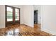 Spacious entryway with coat rack, bench, and beautiful hardwood floors at 4905 Hidden Pasture Way, Zebulon, NC 27597