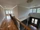 Grand foyer featuring high ceilings, modern chandelier, hardwood floors, and a staircase at 4905 Hidden Pasture Way, Zebulon, NC 27597