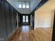 Grand foyer with high ceilings, hardwood floors, and custom trim details leads to a cozy interior at 4905 Hidden Pasture Way, Zebulon, NC 27597