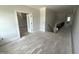 Open hallway with hardwood floors at 4905 Hidden Pasture Way, Zebulon, NC 27597