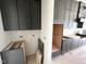 Spacious kitchen with modern gray cabinets and lots of storage space awaiting installation at 4905 Hidden Pasture Way, Zebulon, NC 27597