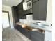Unfinished spacious kitchen with gray cabinets, ample counter space, awaiting completion at 4905 Hidden Pasture Way, Zebulon, NC 27597