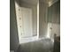 The laundry room features a door, modern tiling, and neutral green cabinetry with a light countertop at 4905 Hidden Pasture Way, Zebulon, NC 27597
