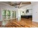 Open floor plan showcasing kitchen with island and outdoor patio at 4905 Hidden Pasture Way, Zebulon, NC 27597