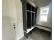 Mudroom with gray shelving and a built-in bench, perfect for organizing coats and shoes at 4905 Hidden Pasture Way, Zebulon, NC 27597