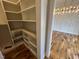 Walk-in pantry with custom shelves and plenty of storage space, located near the dining room at 4905 Hidden Pasture Way, Zebulon, NC 27597