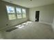 Bright room with large windows offering scenic outdoor views at 4905 Hidden Pasture Way, Zebulon, NC 27597