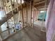 A look at a room being constructed with the staircase being built, shows the insulation in the walls and the floor at 4905 Hidden Pasture Way, Zebulon, NC 27597