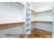 Large walk-in closet with custom shelving and storage solutions at 4905 Hidden Pasture Way, Zebulon, NC 27597