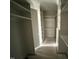 Large walk-in closet with shelving and storage spaces at 4905 Hidden Pasture Way, Zebulon, NC 27597