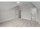 Bedroom with neutral walls, plush carpeting, ceiling fan and a doorway leading to bathroom at 4909 Hidden Pasture Way, Zebulon, NC 27597