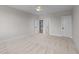 Spacious bedroom with neutral tones, carpet flooring, and multiple doorways at 4909 Hidden Pasture Way, Zebulon, NC 27597