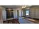 Bathroom with double vanity, large mirror, and walk-in shower at 829 Emmer St, Rolesville, NC 27571