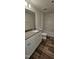 Bathroom with tub, shower, vanity, and wood-look floor at 829 Emmer St, Rolesville, NC 27571