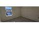 Bright bedroom with carpeted floor and a large window at 829 Emmer St, Rolesville, NC 27571