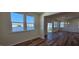 Open concept dining area with hardwood floors and access to the back deck at 829 Emmer St, Rolesville, NC 27571