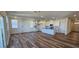 Open concept dining area with hardwood floors and access to the back deck at 829 Emmer St, Rolesville, NC 27571