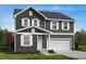 Two-story home with gray siding, white trim, and a two-car garage at 829 Emmer St, Rolesville, NC 27571