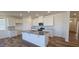 Modern kitchen with white cabinets, granite countertops, and an island at 829 Emmer St, Rolesville, NC 27571