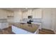 Modern kitchen with white cabinets, granite countertops, and an island at 829 Emmer St, Rolesville, NC 27571
