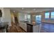 Modern kitchen island with stainless steel appliances and hardwood floors at 829 Emmer St, Rolesville, NC 27571