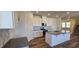Modern kitchen with white cabinets, granite countertops, and an island at 829 Emmer St, Rolesville, NC 27571