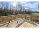 Large wooden back deck and railing offer great outdoor space and views at 69 Browning Mill Dr, Wendell, NC 27591