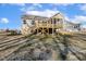 Exterior of the house, with a back deck and screened porch in the backyard at 69 Browning Mill Dr, Wendell, NC 27591