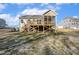 Back exterior of the house features a large deck and a screened in porch at 69 Browning Mill Dr, Wendell, NC 27591