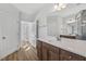 Bathroom features a spacious vanity with drawers and doors, a sink, and hardwood floors at 69 Browning Mill Dr, Wendell, NC 27591