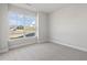 Spacious bedroom with large window and carpet at 69 Browning Mill Dr, Wendell, NC 27591