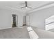 A bright bedroom with carpet, ceiling fan and adjacent rooms, perfect for relaxation at 69 Browning Mill Dr, Wendell, NC 27591