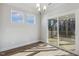 A dining room area with sliding glass doors to a screened-in deck at 69 Browning Mill Dr, Wendell, NC 27591