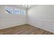 Bright dining room featuring wood floors and wainscoting at 69 Browning Mill Dr, Wendell, NC 27591