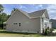 Side view of the home showcasing the siding, windows, and landscaping at 69 Browning Mill Dr, Wendell, NC 27591