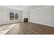 The living room features a fireplace, hardwood floors and natural light at 69 Browning Mill Dr, Wendell, NC 27591