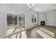 The living room features a fireplace and sliding doors to a screened in deck at 69 Browning Mill Dr, Wendell, NC 27591
