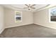 Spacious bedroom with carpeted floors and large windows offering natural light at 122 Wilderness Trl, Smithfield, NC 27577