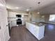 Modern kitchen with granite countertops and stainless steel appliances at 122 Wilderness Trl, Smithfield, NC 27577