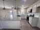 Modern kitchen with granite countertops, stainless steel appliances, and an island at 122 Wilderness Trl, Smithfield, NC 27577