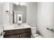 Neutral bathroom with a modern vanity and a large mirror above a white countertop at 55 Browning Mill Dr, Wendell, NC 27591