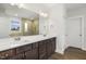 Bathroom features a double sink vanity, and a large mirror over white countertops at 55 Browning Mill Dr, Wendell, NC 27591