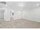 Bright bedroom featuring neutral carpet, white walls, and an open doorway at 55 Browning Mill Dr, Wendell, NC 27591
