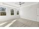 Bright, airy bedroom featuring soft carpet flooring and two windows for ample natural light at 55 Browning Mill Dr, Wendell, NC 27591