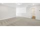 Upstairs bonus room with neutral walls and carpet, and open access to other spaces at 55 Browning Mill Dr, Wendell, NC 27591