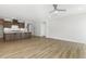 Open-concept living room with hardwood floors, a ceiling fan, and seamless integration with the kitchen area at 55 Browning Mill Dr, Wendell, NC 27591