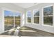 Living space with sliding glass door, hardwood floors, and a view of the deck and backyard at 55 Browning Mill Dr, Wendell, NC 27591
