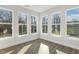 Living space with hardwood floors and multiple windows that offer natural light and scenic views at 55 Browning Mill Dr, Wendell, NC 27591