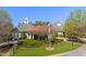 Beautiful clubhouse with manicured landscaping and inviting entrance for leisure and social gatherings at 11548 Helmond Way # 120, Raleigh, NC 27617