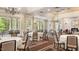 Spacious event space featuring elegant chandeliers, large windows, and neutral decor for versatile use at 11548 Helmond Way # 120, Raleigh, NC 27617